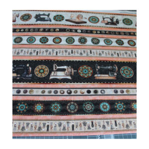 13.80EUR/m - Baumwollstoff, Patchworkstoff - Nähmaschinen gestreift - schwarz/ beige/ orange